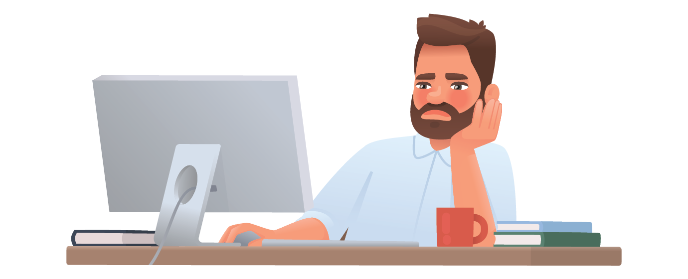 Man with beard sitting at desk, looking bored, using a computer, with books and a red mug nearby.